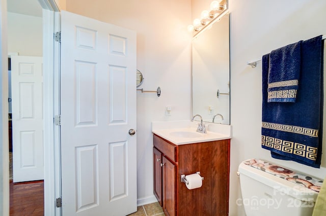 bathroom with toilet and vanity