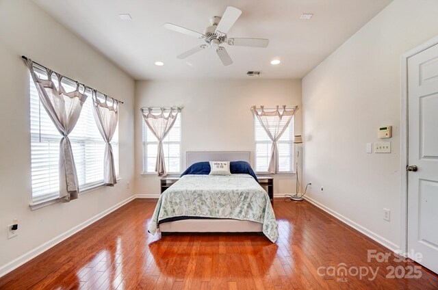 bedroom featuring hardwood / wood-style flooring, recessed lighting, visible vents, a ceiling fan, and baseboards