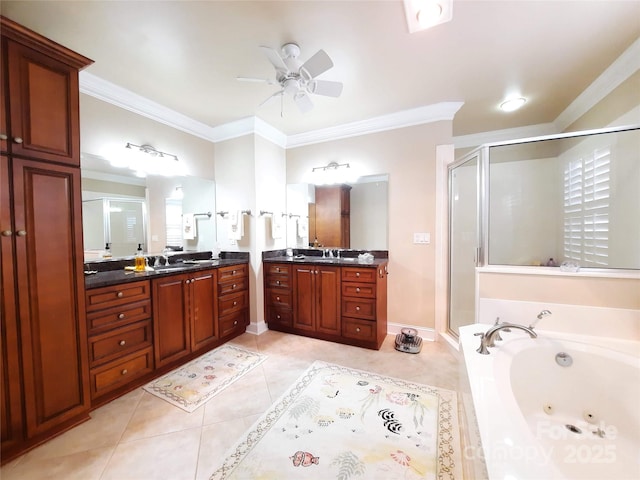 full bathroom featuring a shower stall, a tub with jets, two vanities, and a sink