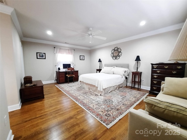 bedroom featuring baseboards, ceiling fan, wood finished floors, crown molding, and recessed lighting