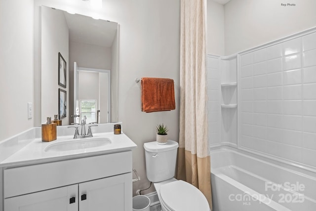 bathroom featuring shower / tub combo, vanity, and toilet