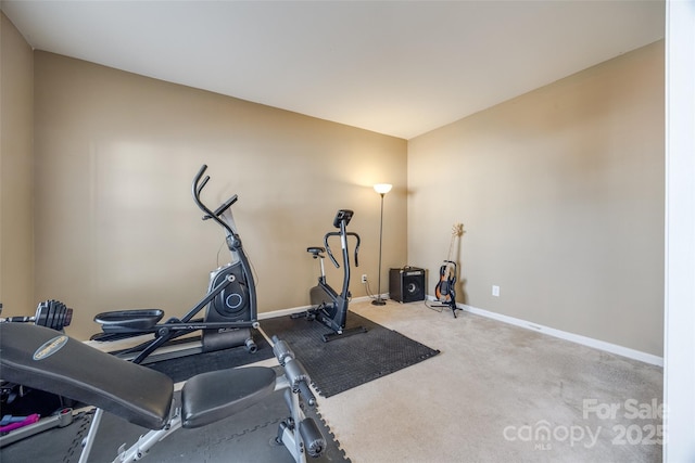 exercise area with carpet floors and baseboards