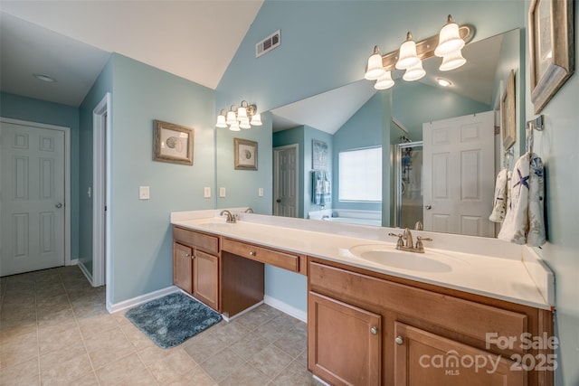 full bathroom featuring lofted ceiling, a sink, visible vents, and a shower stall