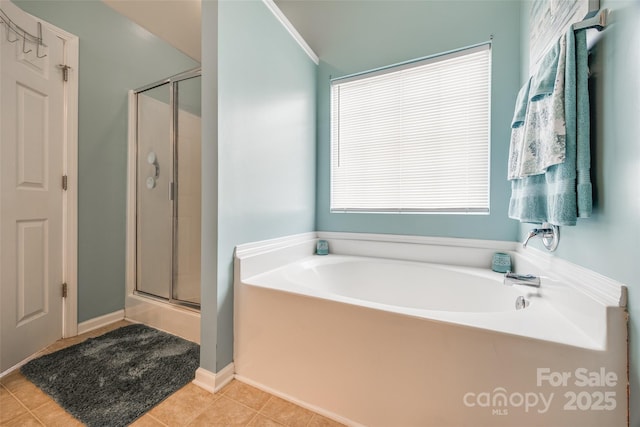 full bathroom with a garden tub, tile patterned flooring, and a shower stall