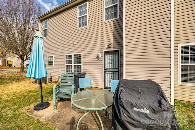 rear view of property featuring a yard