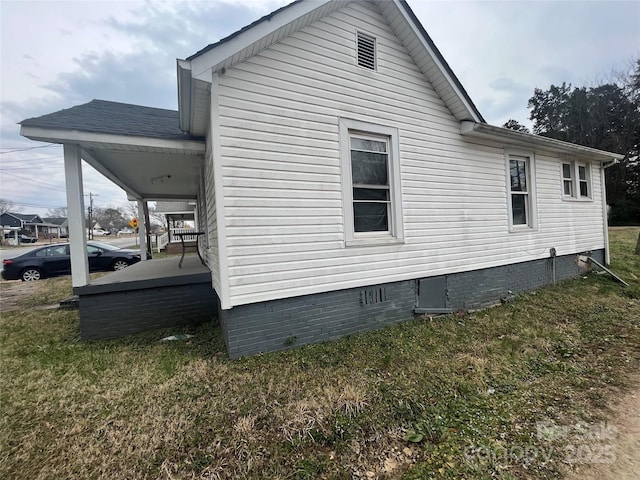 view of property exterior with crawl space and a lawn