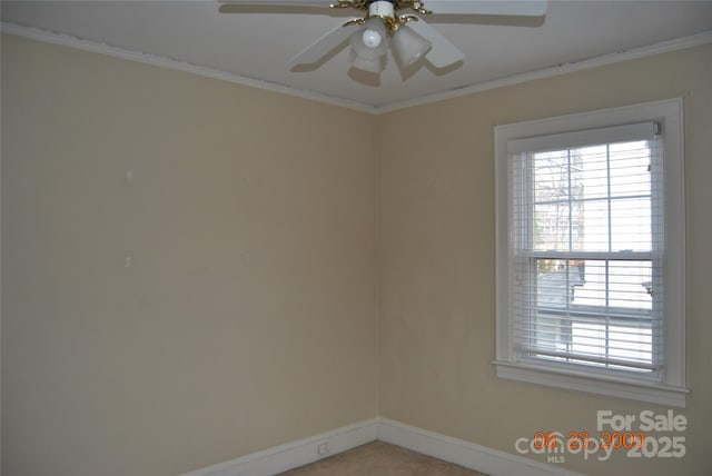 unfurnished room with a ceiling fan, baseboards, a wealth of natural light, and ornamental molding