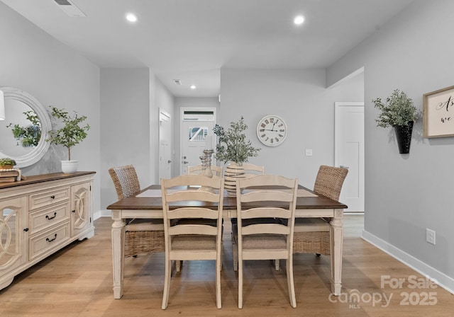 dining space with light wood-type flooring, baseboards, visible vents, and recessed lighting