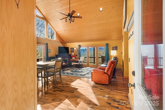 sunroom featuring lofted ceiling, wood ceiling, ceiling fan, and french doors