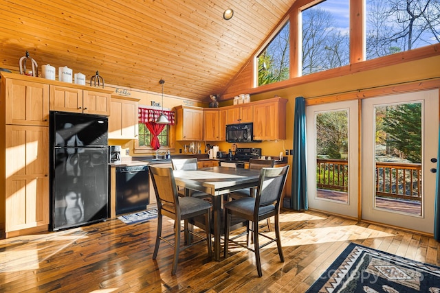 dining area featuring light wood-style floors, wood ceiling, and high vaulted ceiling