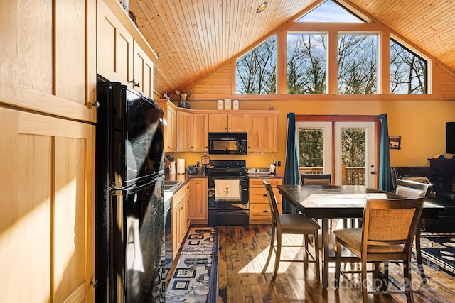 kitchen with black appliances, a wealth of natural light, light brown cabinets, and wood ceiling