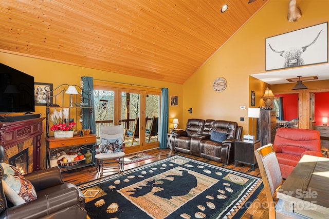 living room with high vaulted ceiling, wooden ceiling, a fireplace, wood finished floors, and french doors