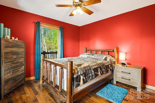 bedroom featuring wood-type flooring, baseboards, and a ceiling fan