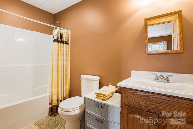 bathroom with shower / bath combination with curtain, tile patterned flooring, vanity, and toilet