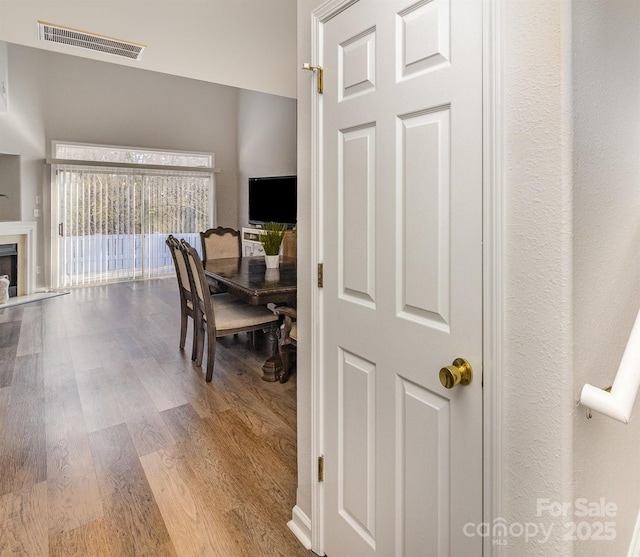 interior space with wood finished floors and visible vents