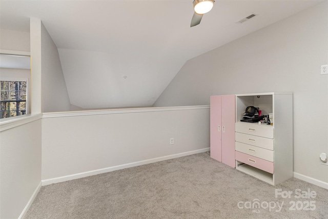 bonus room with ceiling fan, carpet floors, visible vents, baseboards, and vaulted ceiling