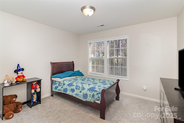 bedroom with carpet floors, baseboards, and visible vents