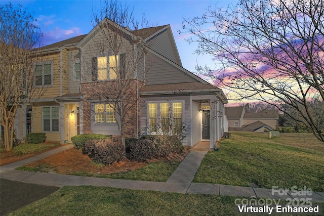 view of front of property with a lawn