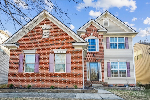 traditional-style house with brick siding