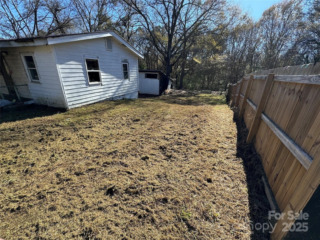 view of yard featuring fence