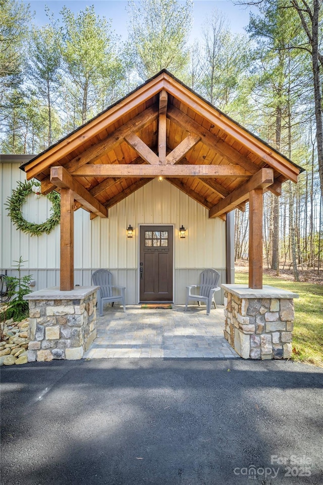 doorway to property with a patio