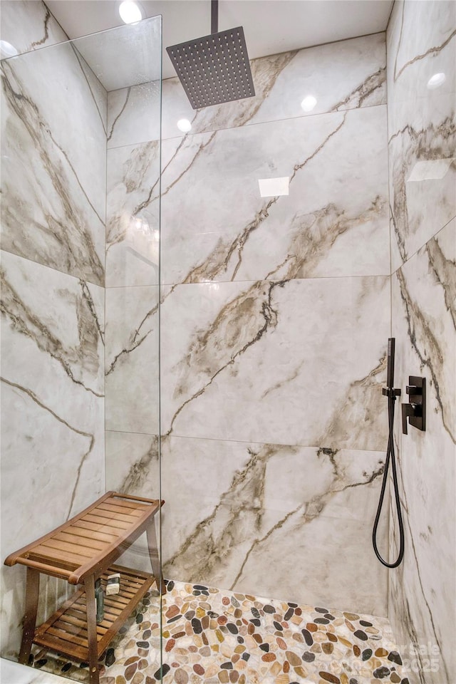 room details with a marble finish shower