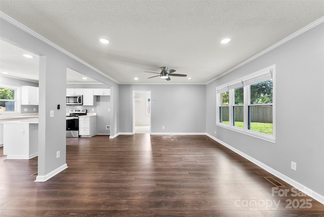 228 Tot Dellinger Rd, Cherryville, NC 28021 - unfurnished living room with crown molding, a ceiling fan, recessed lighting, plenty of natural light, and dark wood-style flooring