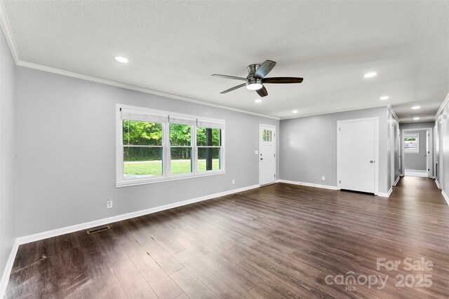 228 Tot Dellinger Rd, Cherryville, NC 28021 - unfurnished living room featuring a ceiling fan, dark wood-type flooring, crown molding, baseboards, and recessed lighting