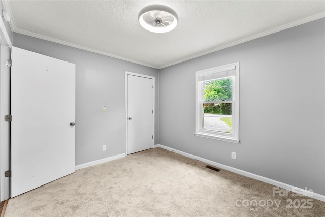 228 Tot Dellinger Rd, Cherryville, NC 28021 - unfurnished bedroom featuring crown molding, carpet, baseboards, and a textured ceiling