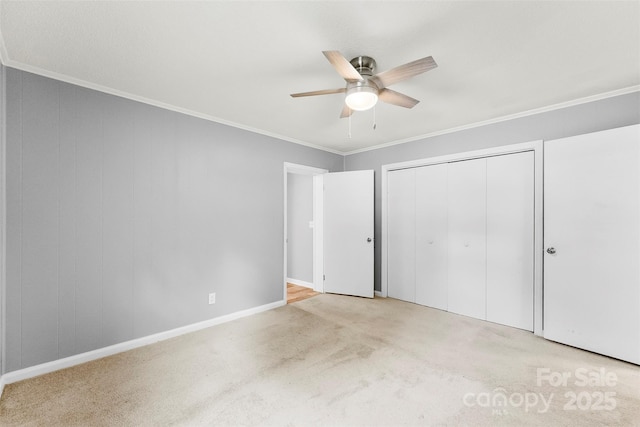 228 Tot Dellinger Rd, Cherryville, NC 28021 - unfurnished bedroom featuring carpet floors, crown molding, a closet, baseboards, and a ceiling fan