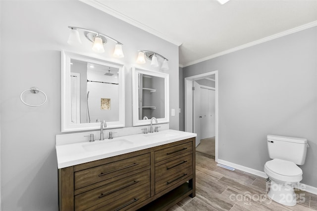 228 Tot Dellinger Rd, Cherryville, NC 28021 - full bathroom with ornamental molding, toilet, wood finished floors, double vanity, and baseboards