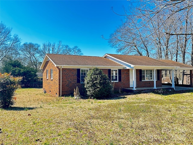 single story home with brick siding and a front lawn