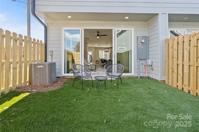 exterior space featuring central AC unit and fence