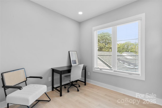 office space featuring recessed lighting, wood finished floors, and baseboards