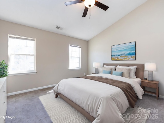 bedroom with visible vents, vaulted ceiling, light carpet, and baseboards