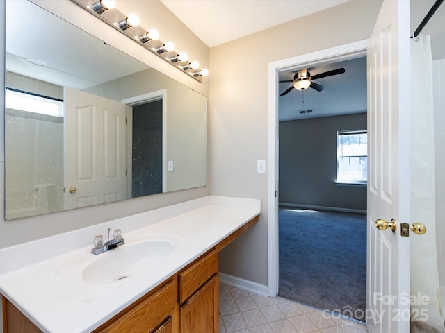 bathroom featuring visible vents, ceiling fan, vanity, and baseboards