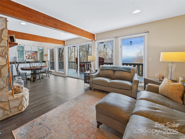 living room featuring recessed lighting, beamed ceiling, and wood finished floors