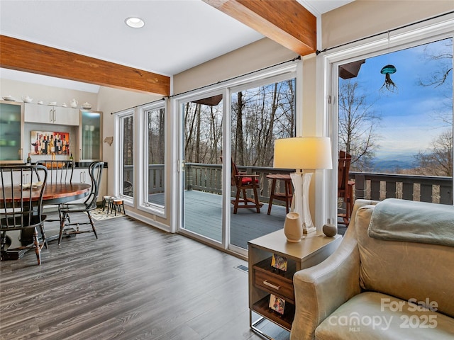 sunroom with beam ceiling