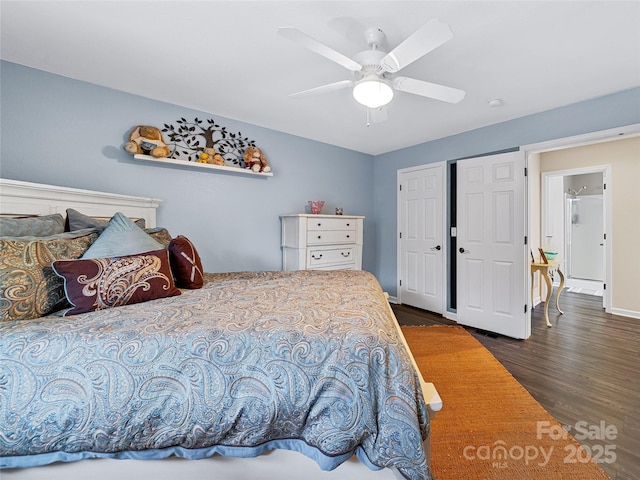 bedroom featuring dark wood-style floors, baseboards, and a ceiling fan