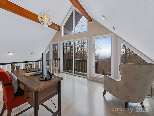 office with visible vents, wood finished floors, beamed ceiling, high vaulted ceiling, and a notable chandelier