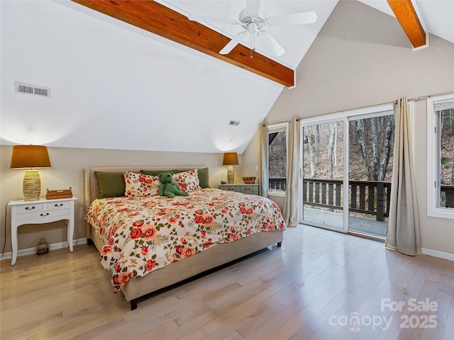 bedroom featuring vaulted ceiling with beams, visible vents, wood finished floors, access to outside, and baseboards