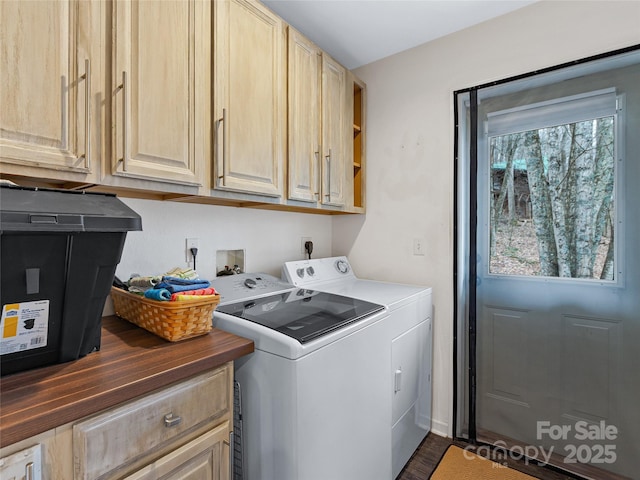 laundry room featuring independent washer and dryer and cabinet space