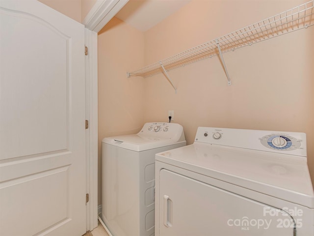 laundry area with independent washer and dryer