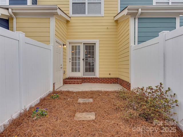 property entrance featuring fence