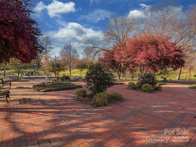 view of property's community featuring playground community