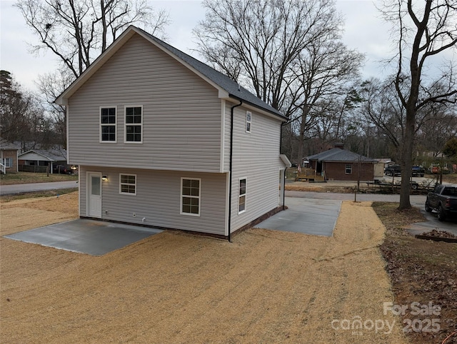 view of side of property featuring a patio