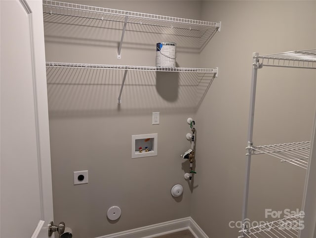 washroom featuring hookup for a washing machine, hookup for an electric dryer, hookup for a gas dryer, laundry area, and baseboards