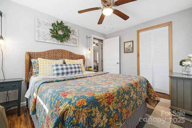 bedroom with a ceiling fan, a closet, and wood finished floors