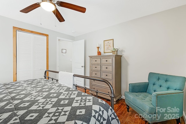 bedroom featuring a ceiling fan, a closet, and wood finished floors