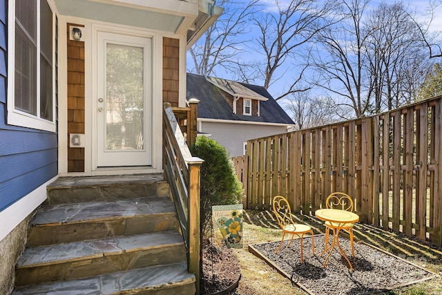 property entrance with fence